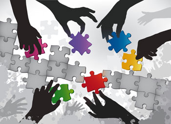Photography showing a colored puzzle with hands moving parts